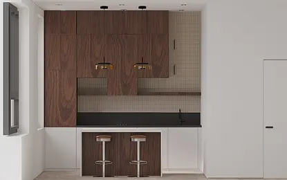 Wnętrze kuchni z drewnianymi meblami, czarnym blatem i nowoczesnym oświetleniem.