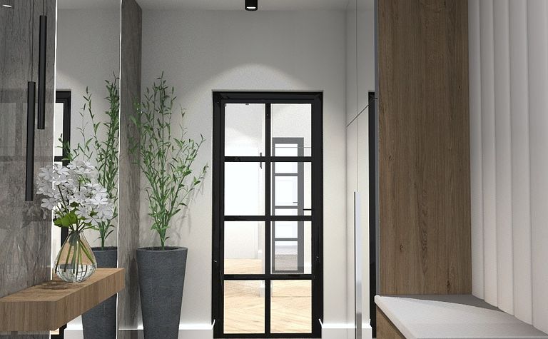 Przedpokój w stylu minimalistycznym z drewnianymi meblami i roślinami.