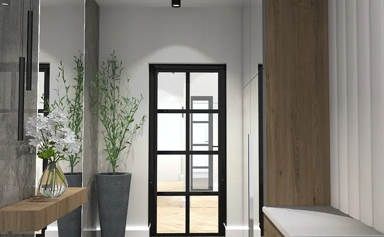 Przedpokój w stylu minimalistycznym z drewnianymi meblami i roślinami.