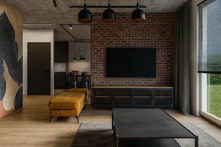Wnętrze salonu z ceglaną ścianą i industrialnym wystrojem.