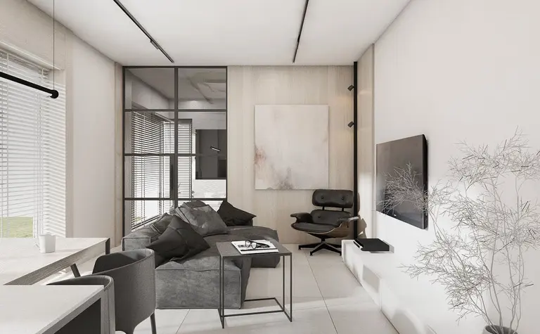 Nowoczesne wnętrze salonu z minimalistycznym designem, szarymi meblami i białymi akcentami.