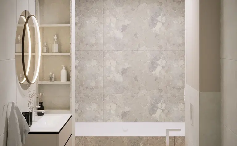 Wnętrze łazienki z minimalistycznym designem, nowoczesne elementy, biała wanna i szare płytki.