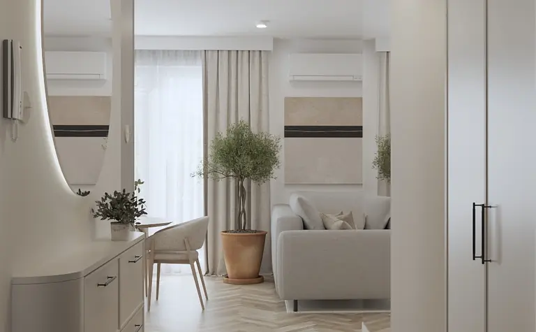 Nowoczesne wnętrze salonu z szarymi elementami, drewnianą podłogą i roślinami