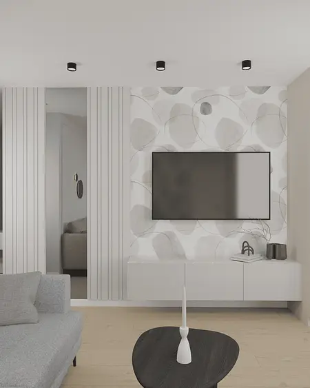Wnętrze salonu w stylu eklektycznym i minimalistycznym z białymi i szarymi elementami.