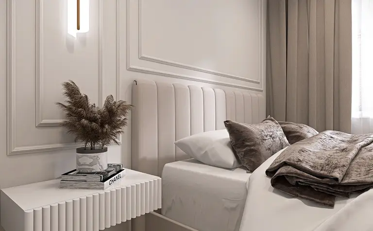 Wnętrze sypialni z nowoczesnym łóżkiem i minimalistycznymi dodatkami.