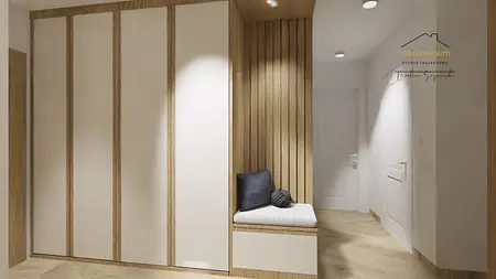 Przedpokój z minimalistycznymi meblami i drewnianymi akcentami.