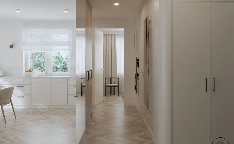 Wnętrze kuchni z białymi meblami i drewnianą podłogą w stylu minimaluxe i nowoczesnym.