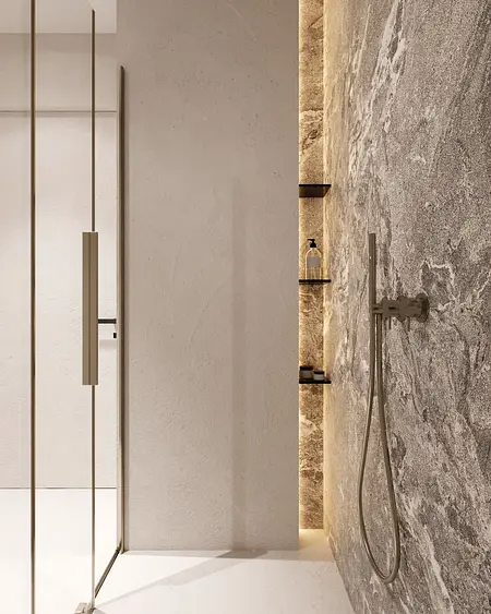 Wnętrze łazienki w stylu minimalistycznym z jasnymi ścianami i nowoczesnym prysznicem.