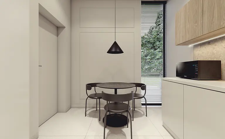 Nowoczesne wnętrze kuchni z minimalistycznym stołem i krzesłami.