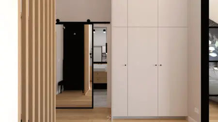 Przedpokój w stylu industrialnym, minimalistycznym z białą szafą i drewnianymi elementami.