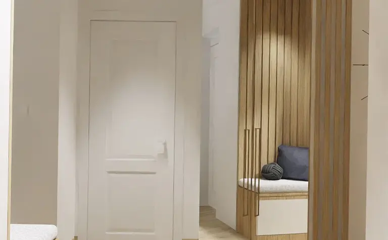 Minimalistyczny przedpokój z drewnianymi detalami i lustrem.