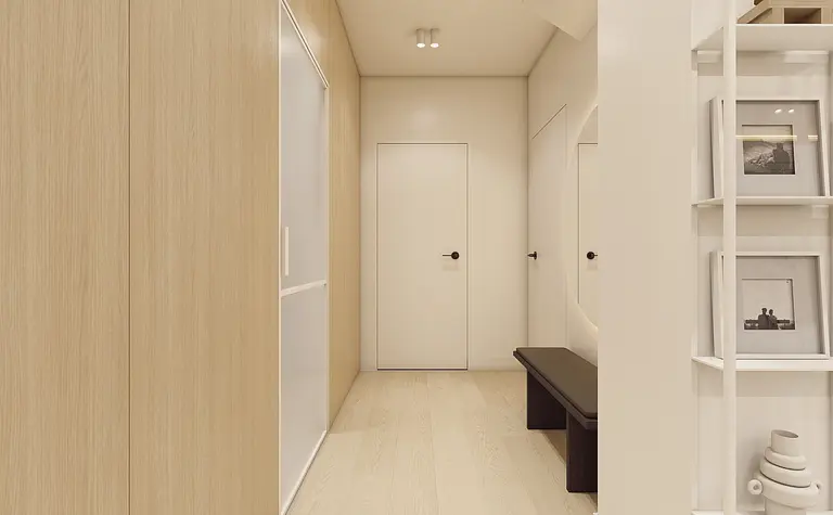 Przedpokój w stylu japandi i minimalistycznym z drewnianymi akcentami.