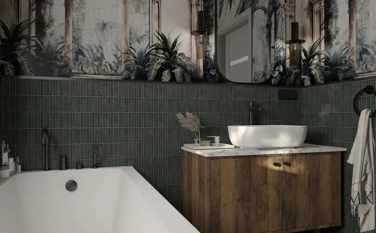 Łazienka w stylu art deco i boho z zieloną glazurą oraz drewnianą szafką.