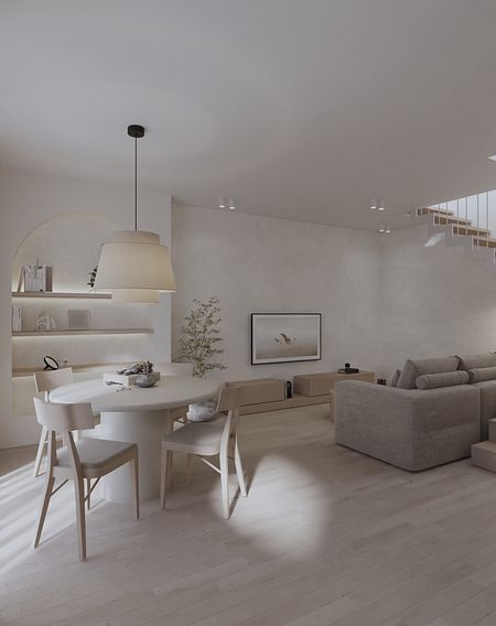 Wnętrze salonu w stylu japandi z jasnymi meblami i drewnianymi detalami.