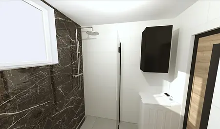 Współczesna łazienka z czarnymi płytkami i prysznicem.