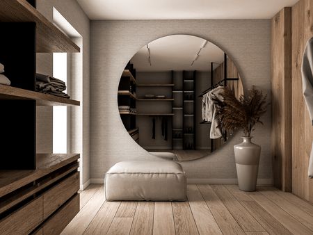 Minimalistyczna garderoba w soft minimalizmie z dużym lustrem i drewnianymi detalami.