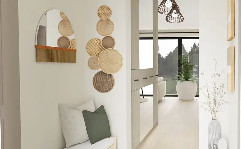 Przedpokój w stylu boho z jasnymi meblami i dekoracjami.
