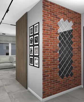 Wnętrze z ceglaną ścianą, szarymi meblami i nowoczesnymi detalami w stylu art deco, boho, industrialnym.