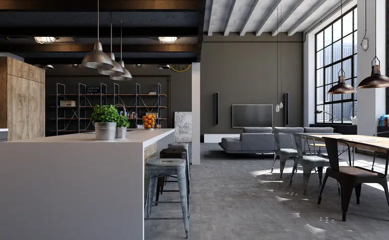 Wnętrze kuchni w stylu industrialnym z nowoczesnymi meblami i dużymi oknami.