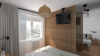 Sypialnia w stylu boho z drewnianymi akcentami, nowoczesnym oświetleniem i skandynawskim wystrojem.