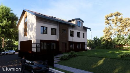 Nowoczesny dom jednorodzinny z brązowymi i białymi detalami, otoczony zielenią.