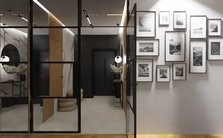 Przedpokój w stylu japandi, minimalistycznym i nowoczesnym z czarnymi detalami.