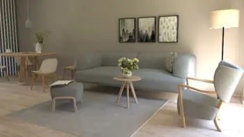 Wnętrze salonu w stylu boho i skandynawskim z szarym narożnikiem.