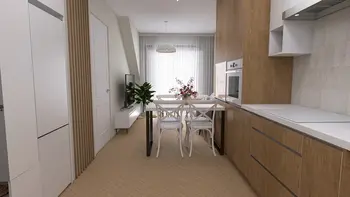 Wnętrze kuchni w stylu minimalistycznym z białymi meblami i drewnianymi akcentami.