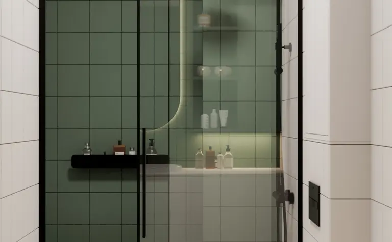 Nowoczesna łazienka z minimalistycznym designem, zielone płytki, prysznic i czarne akcenty.