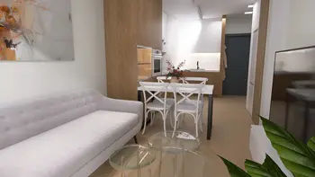 Wnętrze kuchni z minimalistycznym designem, drewnianymi meblami i nowoczesnymi akcentami.