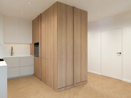 Kuchnia w stylu japandi i minimalistycznym z drewnianymi meblami i białymi elementami.