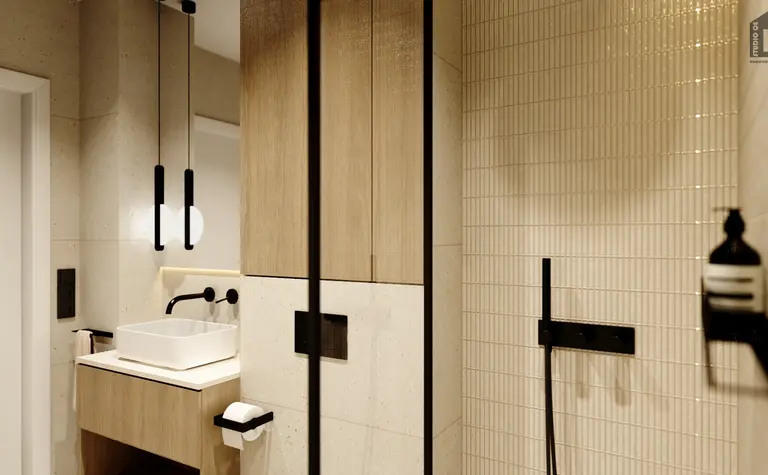 Nowoczesna łazienka z minimalistycznym wystrojem, drewnianymi meblami i eleganckimi akcesoriami.