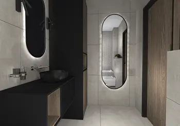 Nowoczesna łazienka w stylu industrialnym z czarną umywalką, dużym lustrem i minimalistycznym wystrojem.