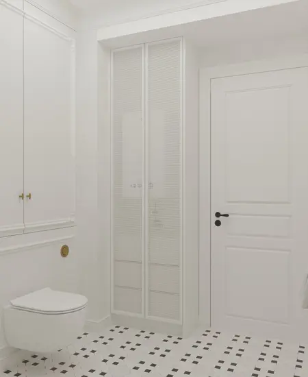 Wnętrze łazienki z białymi meblami, podłogą art deco oraz tradycyjnymi detalami.