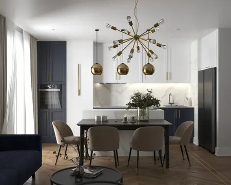 Nowoczesna kuchnia w stylu skandynawskim z granatowymi meblami i złotymi akcentami.