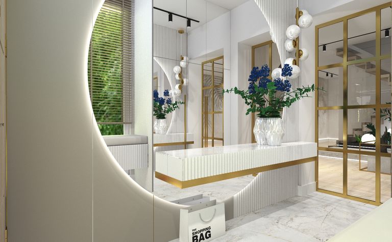 Stylowy przedpokój z białą ławką, złotymi detalami i niebieskimi kwiatami.