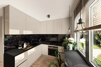 Nowoczesna kuchnia z czarnym blatem, białymi meblami i roślinami, styl industrialny i minimalistyczny.