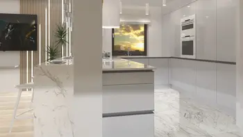 Nowoczesna kuchnia w stylu japandi z marmurowym blatem i minimalistycznym designem.