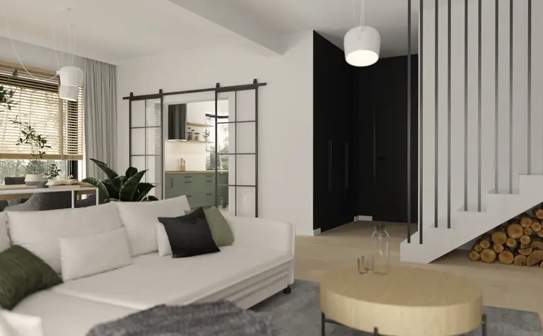 Wnętrze nowoczesnego salonu z zieloną kuchnią i drewnianymi detalami.