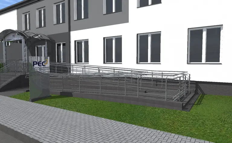 Wejście do budynku z rampą, zieloną trawą i nowoczesnymi detalami. Styl industrialny i minimalistyczny.