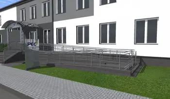 Wejście do budynku z rampą, zieloną trawą i nowoczesnymi detalami. Styl industrialny i minimalistyczny.