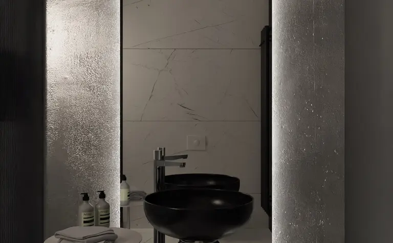 Nowoczesna łazienka z czarną umywalką, białymi kafelkami i minimalistycznym designem.