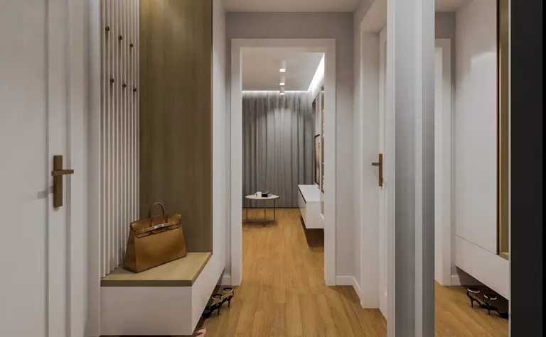 Przedpokój z drewnianą podłogą, białymi meblami i dodatkami w stylu quiet luxury.