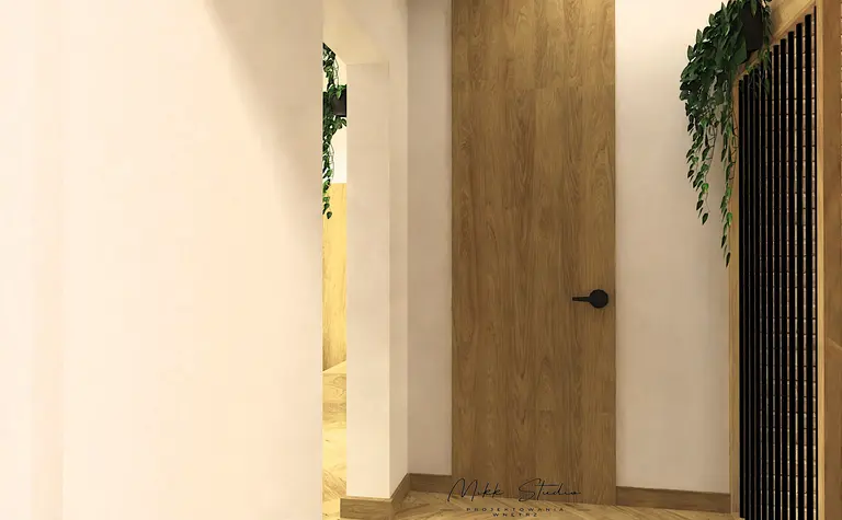 Wnętrze holu z drewnianymi akcentami i roślinnością, styl boho i nowoczesny.