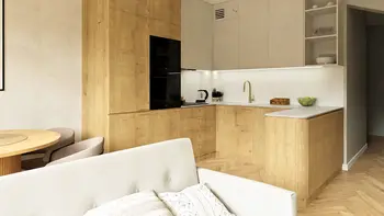 Kuchnia w stylu boho, japandi i minimalistycznym z drewnianymi meblami.