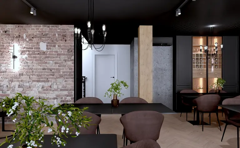 Wnętrze restauracji z ceglaną ścianą i drewnianymi akcentami w stylu industrialnym.