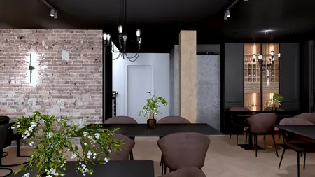 Wnętrze restauracji z ceglaną ścianą i drewnianymi akcentami w stylu industrialnym.