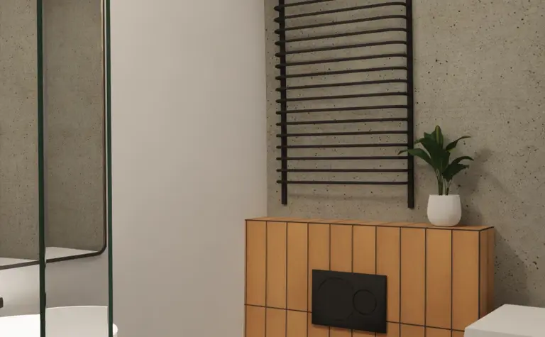 Wnętrze łazienki z minimalistycznym designem, białą toaletą i brązowymi detalami.