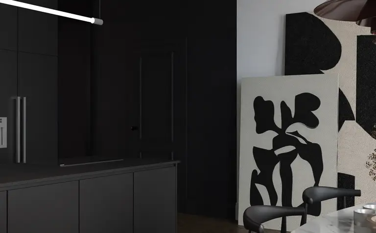 Nowoczesna kuchnia w stylu art deco z czarnymi meblami i białym blatem, eklektyczne detale.