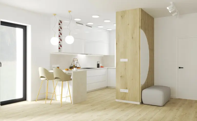 Nowoczesna kuchnia w stylu minimalistycznym z białymi meblami i drewnianymi detalami.